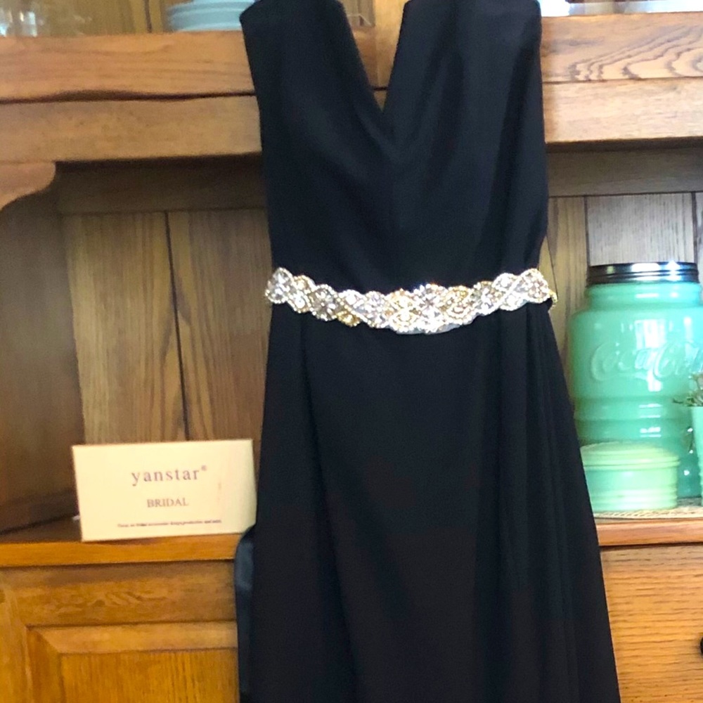 Black Vera Wang, worn once.  David’s bridal